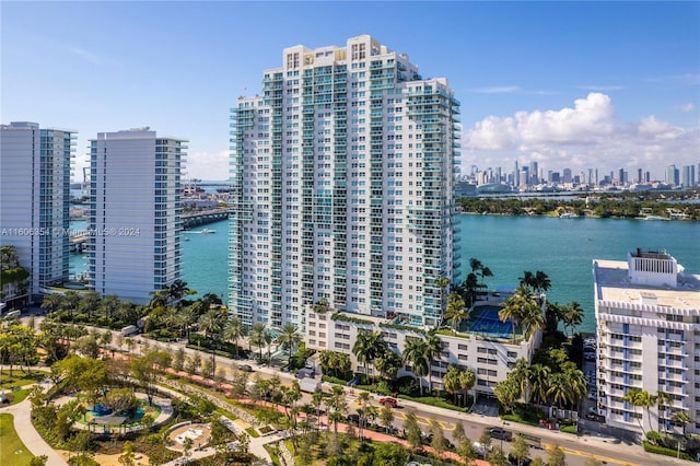 birds eye view of property with a water view