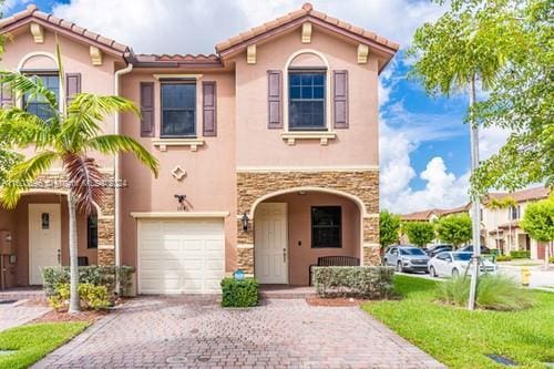 mediterranean / spanish-style house featuring a garage