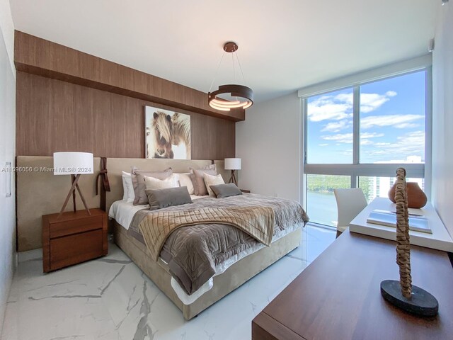 tiled bedroom featuring access to outside