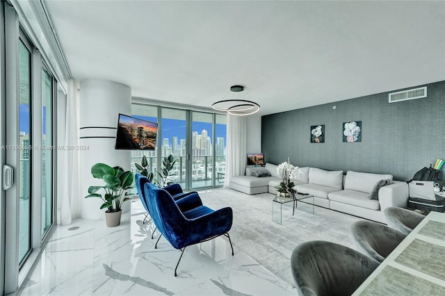 living room with floor to ceiling windows