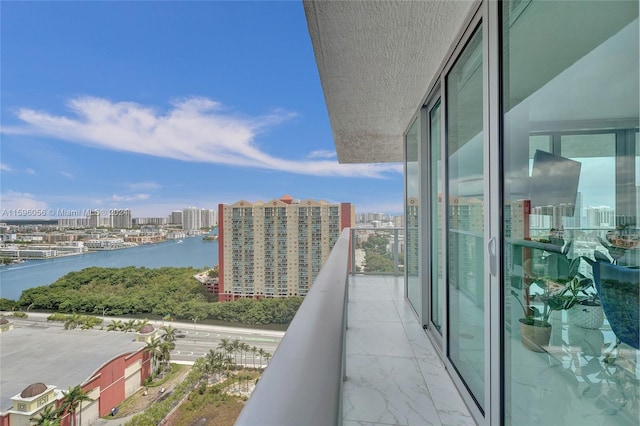 balcony featuring a water view