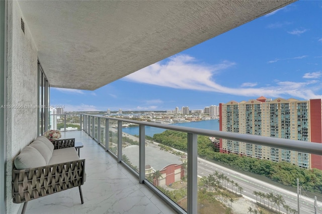 balcony featuring a water view