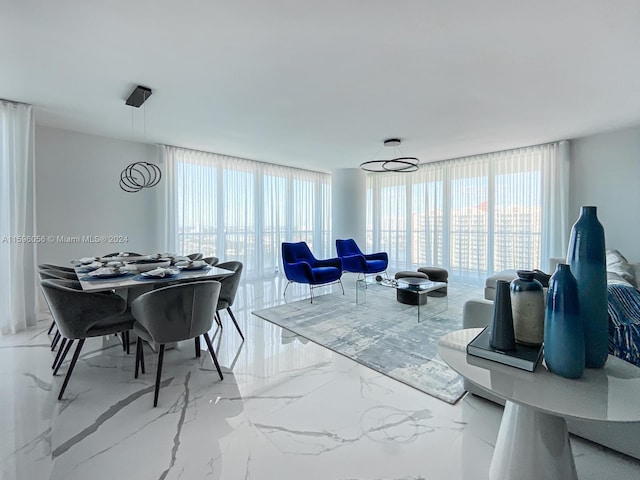 living room featuring floor to ceiling windows