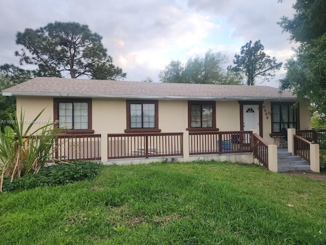 ranch-style home with a front yard