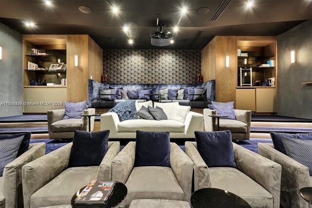 cinema room featuring built in shelves