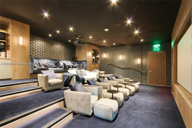 cinema featuring dark colored carpet