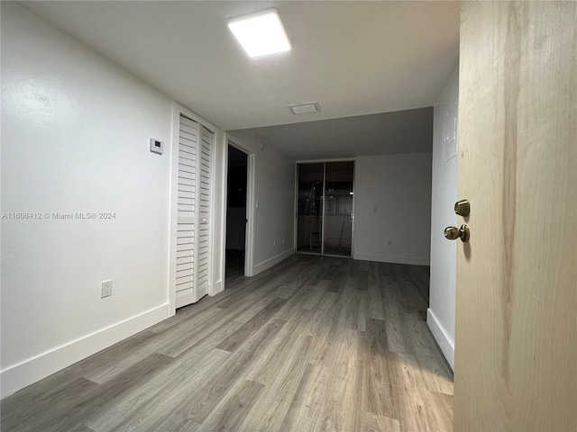 unfurnished room featuring hardwood / wood-style floors