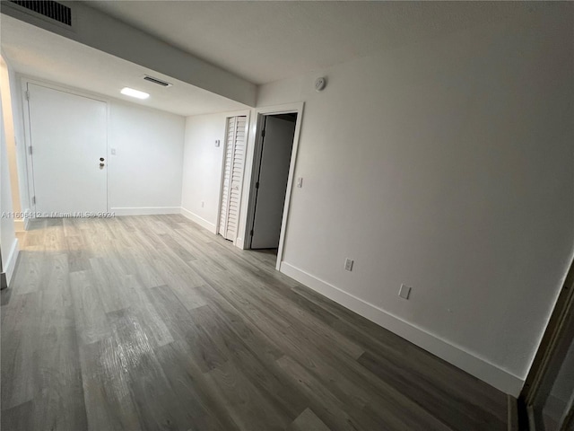 unfurnished room featuring hardwood / wood-style floors