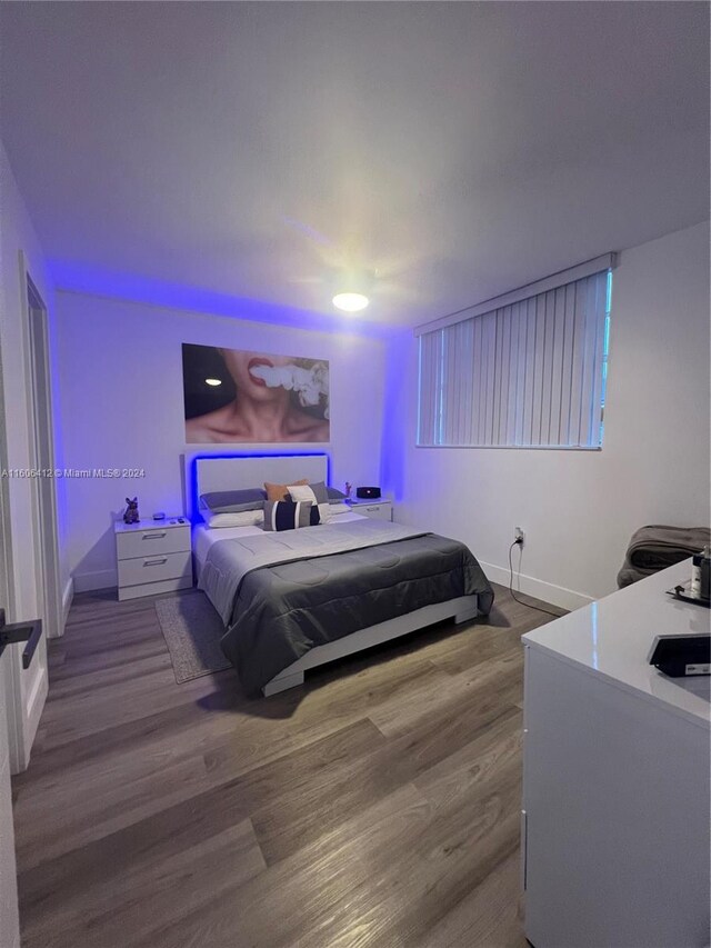 bedroom with wood-type flooring