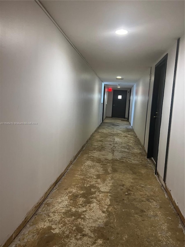 hallway featuring concrete floors