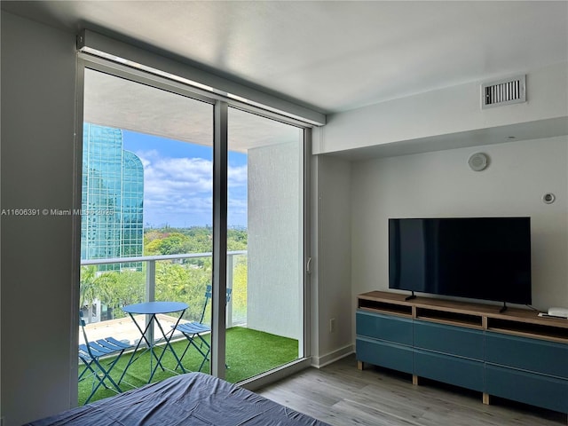 4250 Biscayne Blvd Unit 806, Miami, FL 33137 - bedroom featuring visible vents, light wood-style floors, and multiple windows