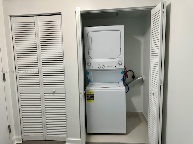 laundry room featuring stacked washing maching and dryer