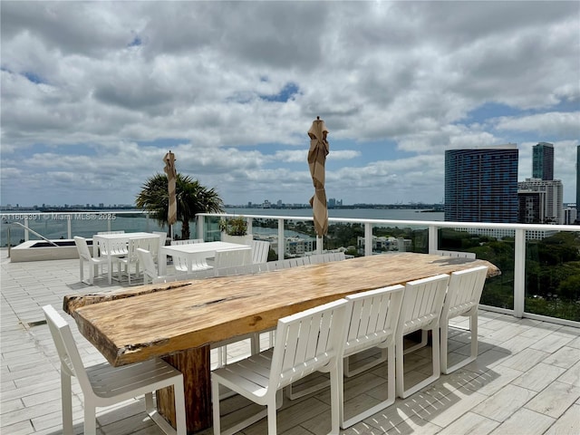 4250 Biscayne Blvd Unit 806, Miami, FL 33137 - exterior space featuring a view of city, a balcony, outdoor dining area, and a water view