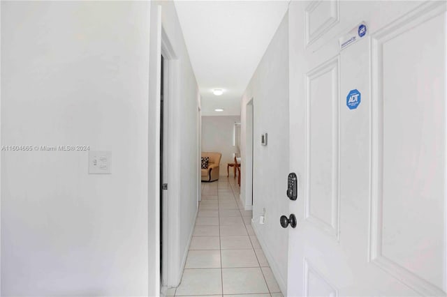 corridor featuring light tile flooring