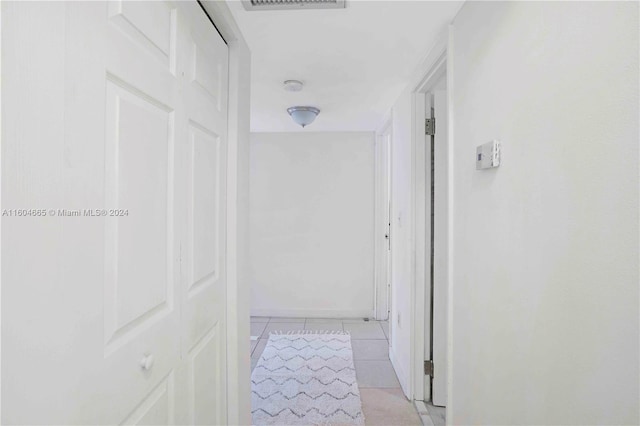 hallway with light tile flooring