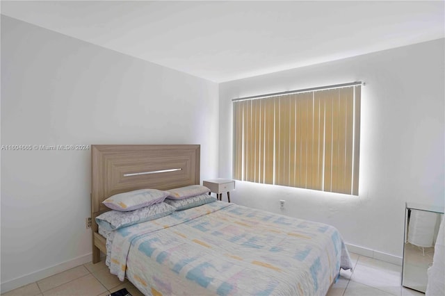 bedroom featuring light tile flooring