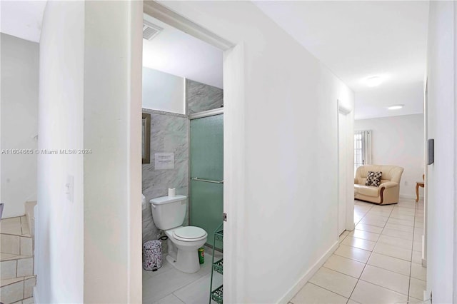 bathroom with tile floors and toilet