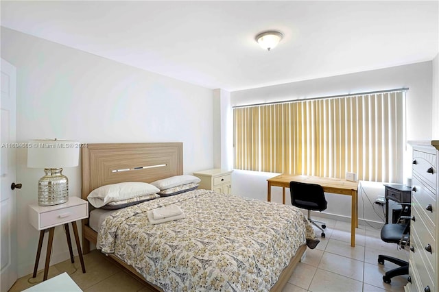 bedroom featuring light tile flooring