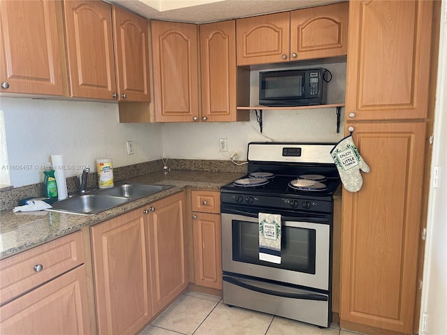 kitchen featuring electric stove, sink, light tile flooring, and stone countertops