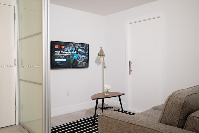 sitting room with light hardwood / wood-style floors