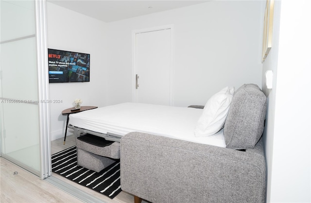 bedroom with hardwood / wood-style floors