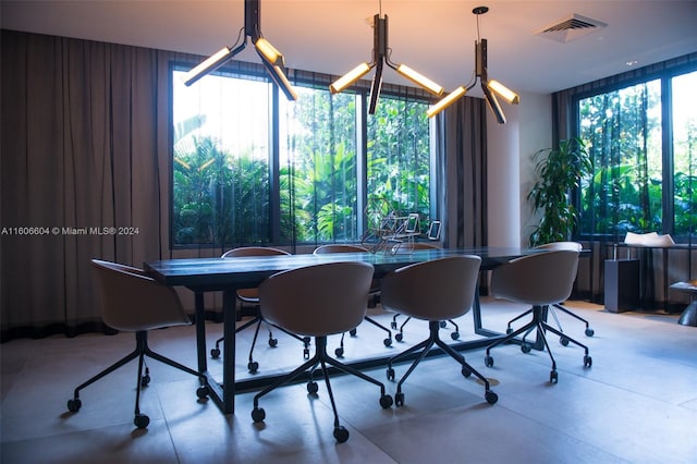 office area featuring expansive windows and a notable chandelier