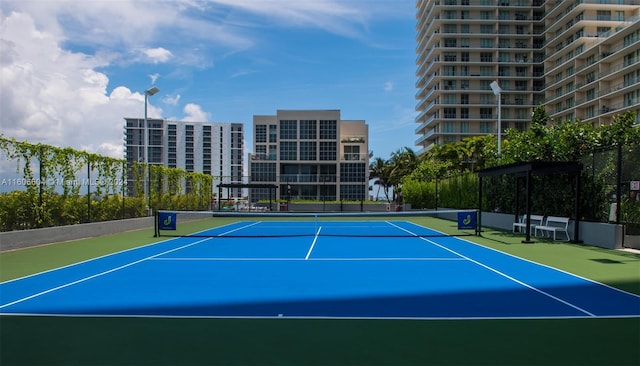 view of tennis court featuring basketball court