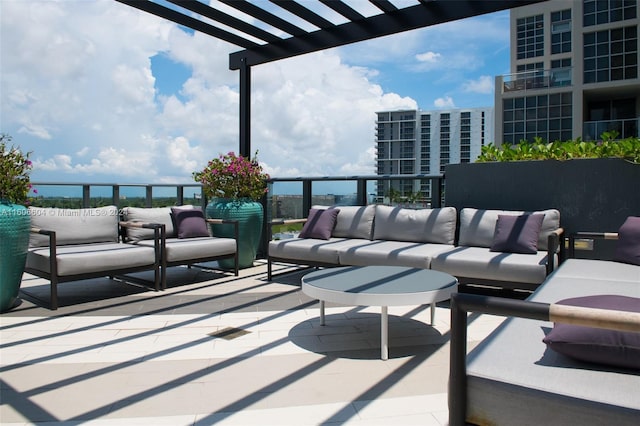 view of patio / terrace with an outdoor hangout area and a pergola