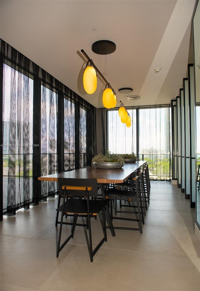 dining room featuring a wall of windows