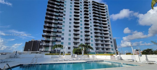 view of swimming pool featuring a patio area