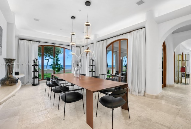 dining room featuring light tile floors