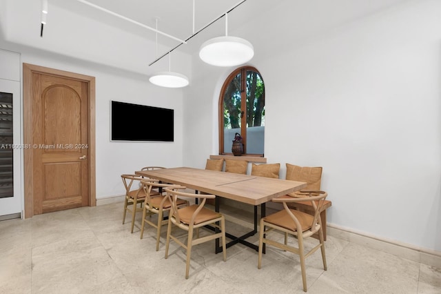 dining area with tile flooring