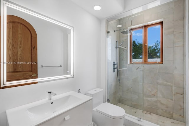 bathroom with an enclosed shower, oversized vanity, and toilet