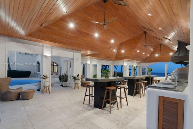 interior space featuring wood ceiling and ceiling fan