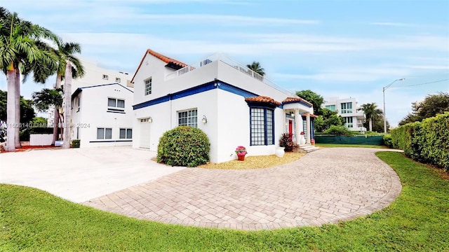 view of home's exterior with a lawn