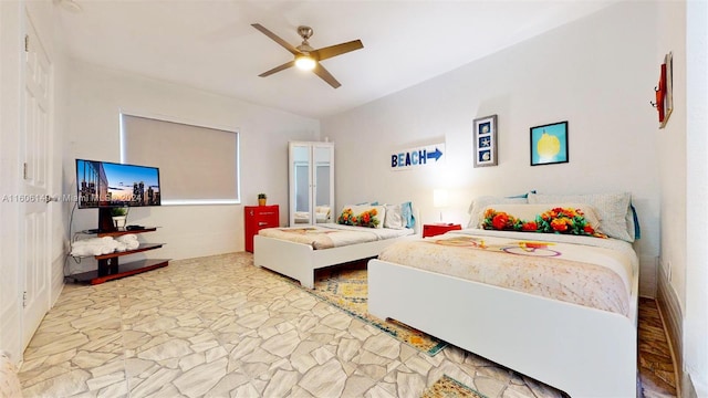 bedroom featuring light hardwood / wood-style flooring and ceiling fan