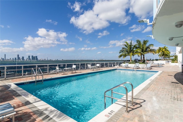 view of pool featuring a patio area