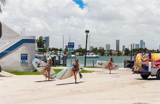 surrounding community featuring a water view