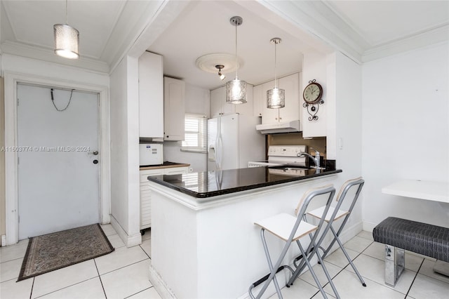 kitchen with crown molding, kitchen peninsula, white cabinets, and light tile floors