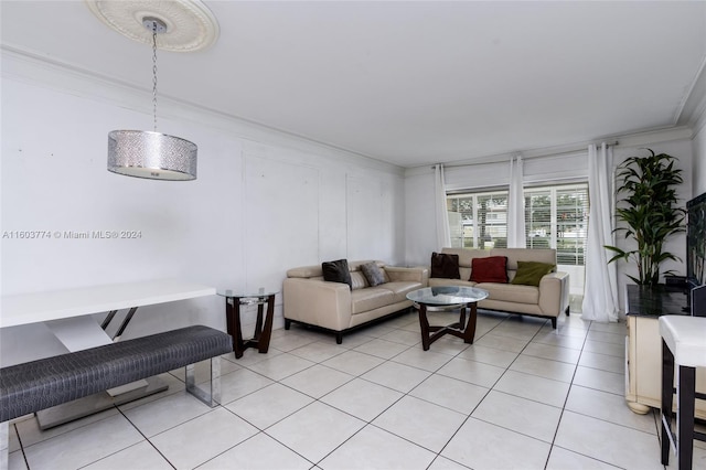 living room featuring light tile patterned flooring and ornamental molding