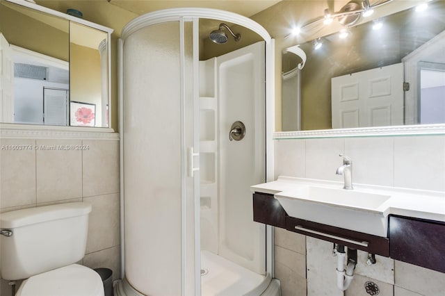 bathroom with a shower, tile walls, and toilet