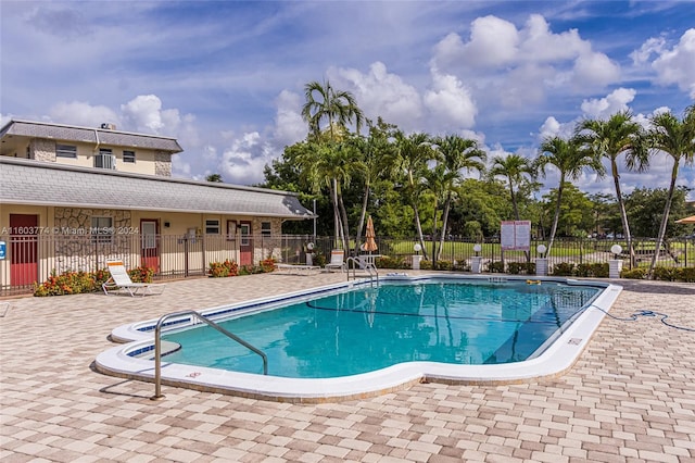 view of swimming pool with a patio