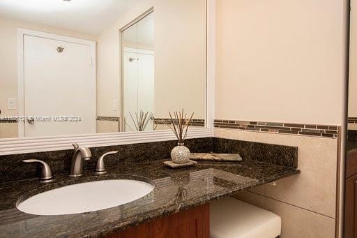 bathroom featuring vanity with extensive cabinet space