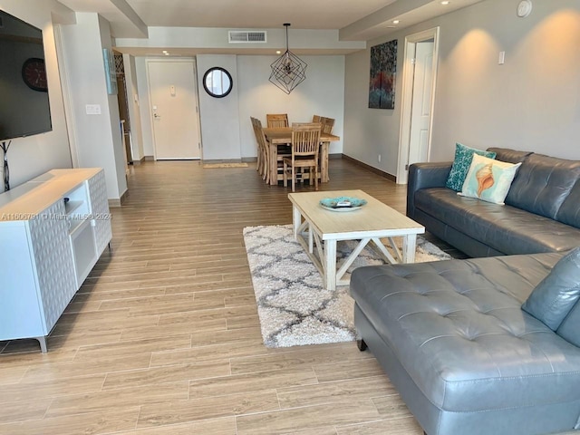 living room with light hardwood / wood-style floors