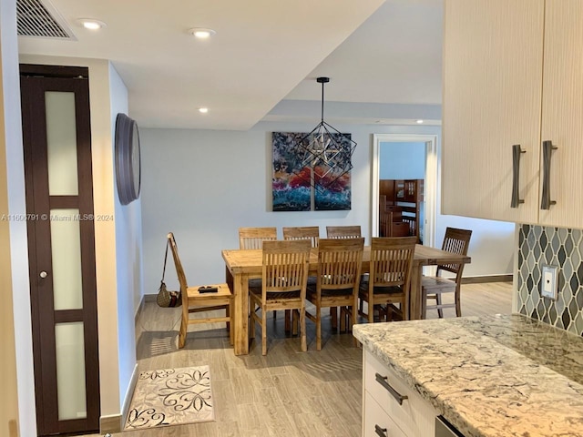 dining area featuring light wood-type flooring