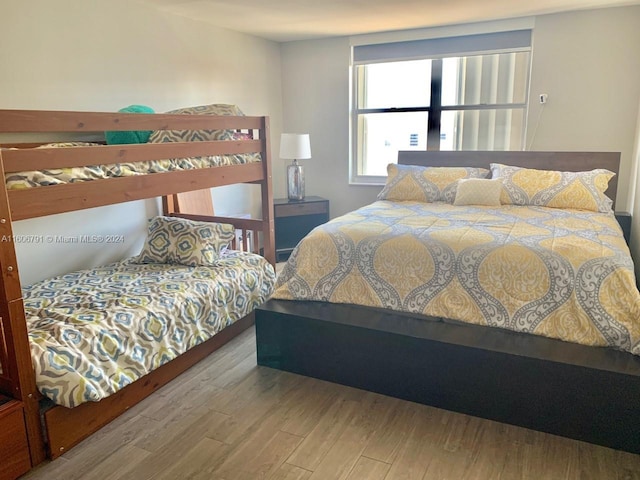 bedroom with wood-type flooring