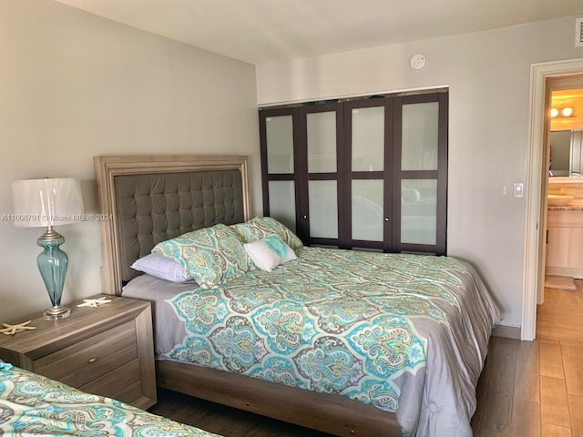 bedroom featuring hardwood / wood-style floors