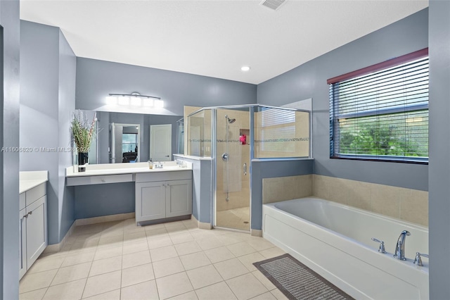 bathroom with tile flooring, separate shower and tub, and vanity