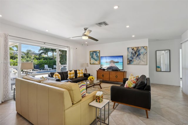 tiled living room with ceiling fan