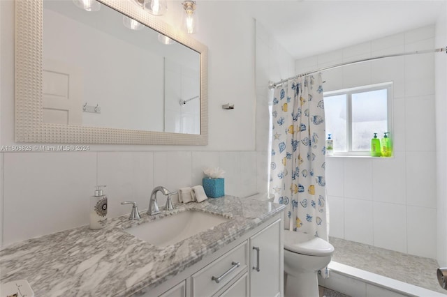 bathroom featuring toilet, a shower with shower curtain, and vanity